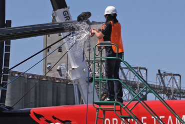 Judith Sim of Oracle Corp. opens up on Oracle Team USA's new America's Cup cat. Photo:©2013 Chuck Lantz