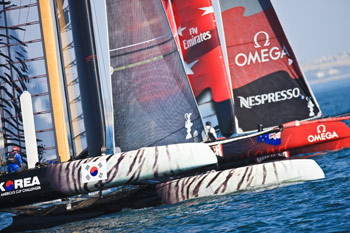 Catching a tiger. ETNZ sailed themselves back into Fleet Race 3 from the back of the fleet, and edged Korea for the win. Photo:2011 Gilles Martin-Raget/americascup.com